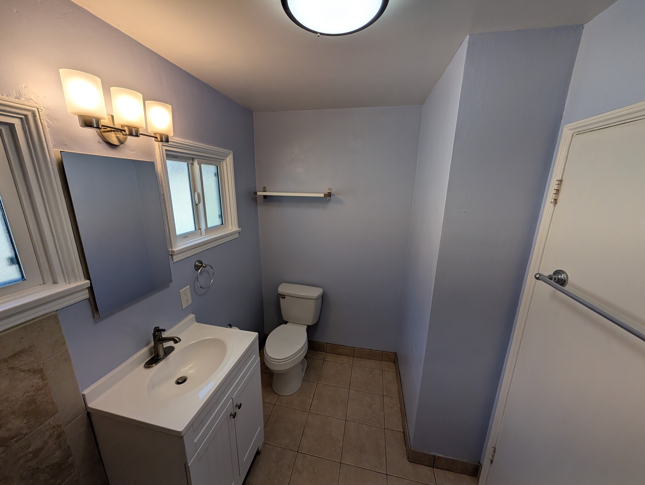 Two windows to invite natural light into the bathroom - 4828 Sawtelle Blvd