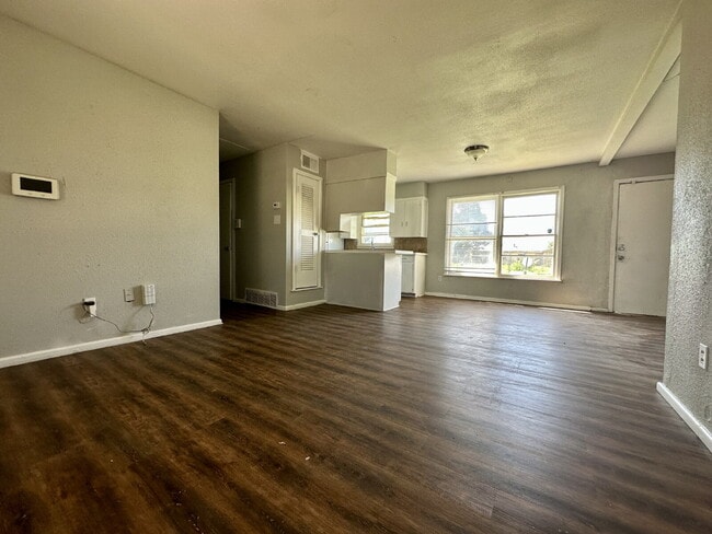 Building Photo - Updated Home with Gorgeous Floors & Large Backyard