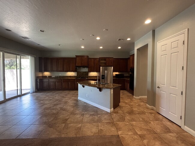 Building Photo - 5-Bed Retreat with Granite Elegance & Cozy Fireplace – 3690 Sq Ft of Comfort in Las Vegas with a ...