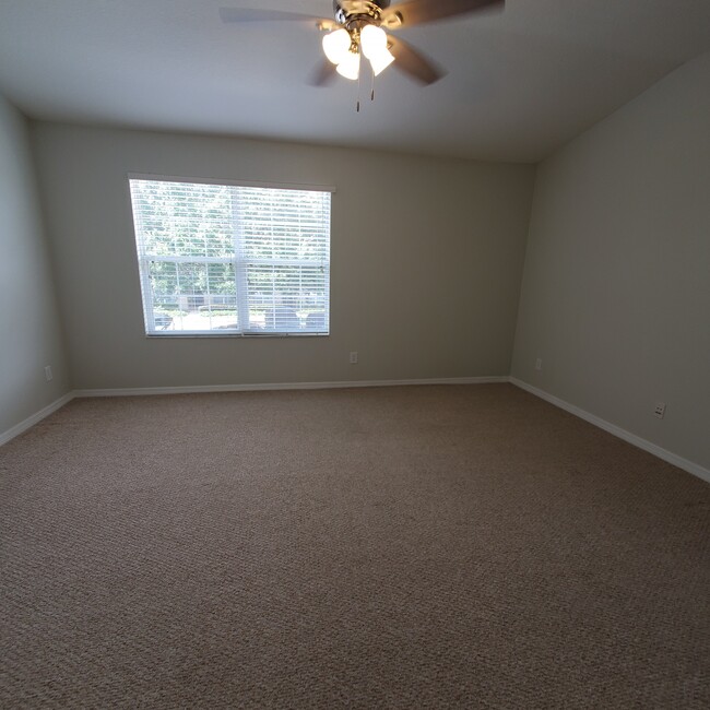 Primary bedroom, freshly cleaned carpet - 5808 Fishhawk Ridge Dr