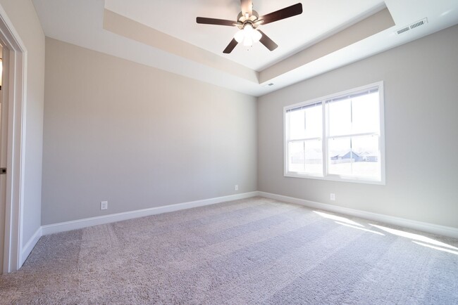 Building Photo - Elegant Home with Stone Fireplace, Kitchen Island and Designer Primary Suite