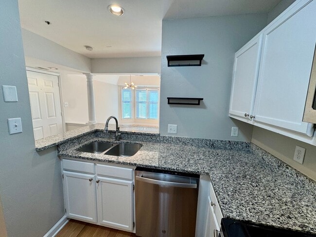 Building Photo - Top-Floor End Unit Condo at New Bern Place