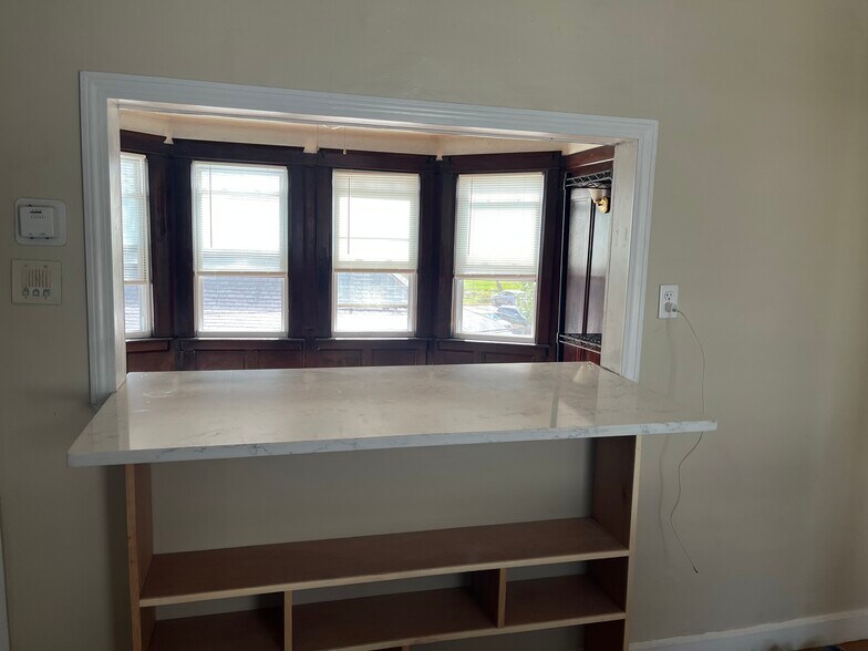 quartz counter opening to living room - 61 Wall St