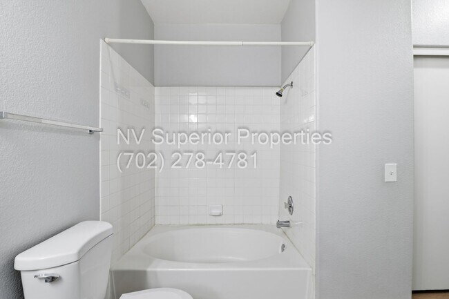 Building Photo - SW!!! 2 Bedroom Condo 1st Floor!! 2 Garage!! Gated!! Community Pool!! Fitness Room!! 2 Primary Be...