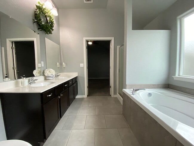 Building Photo - WELCOME TO YOUR CHARMING HOME AT THE COTTA...