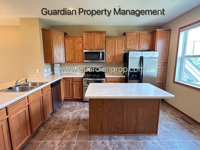 Building Photo - Pet Free Champlin Town Home, 3.5 Baths, 2 Car Garage, Dishwasher, Balcony, Available end of April