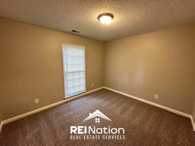 Building Photo - CORDOVA COVE CHARMER! 3BR/2BA | High Ceilings & Brick Fireplace | 2-Car Garage!