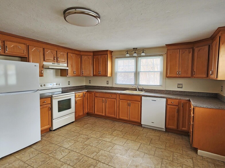 Large eat in kitchen with dishwasher, stove, and refrigerator - 216 5th St