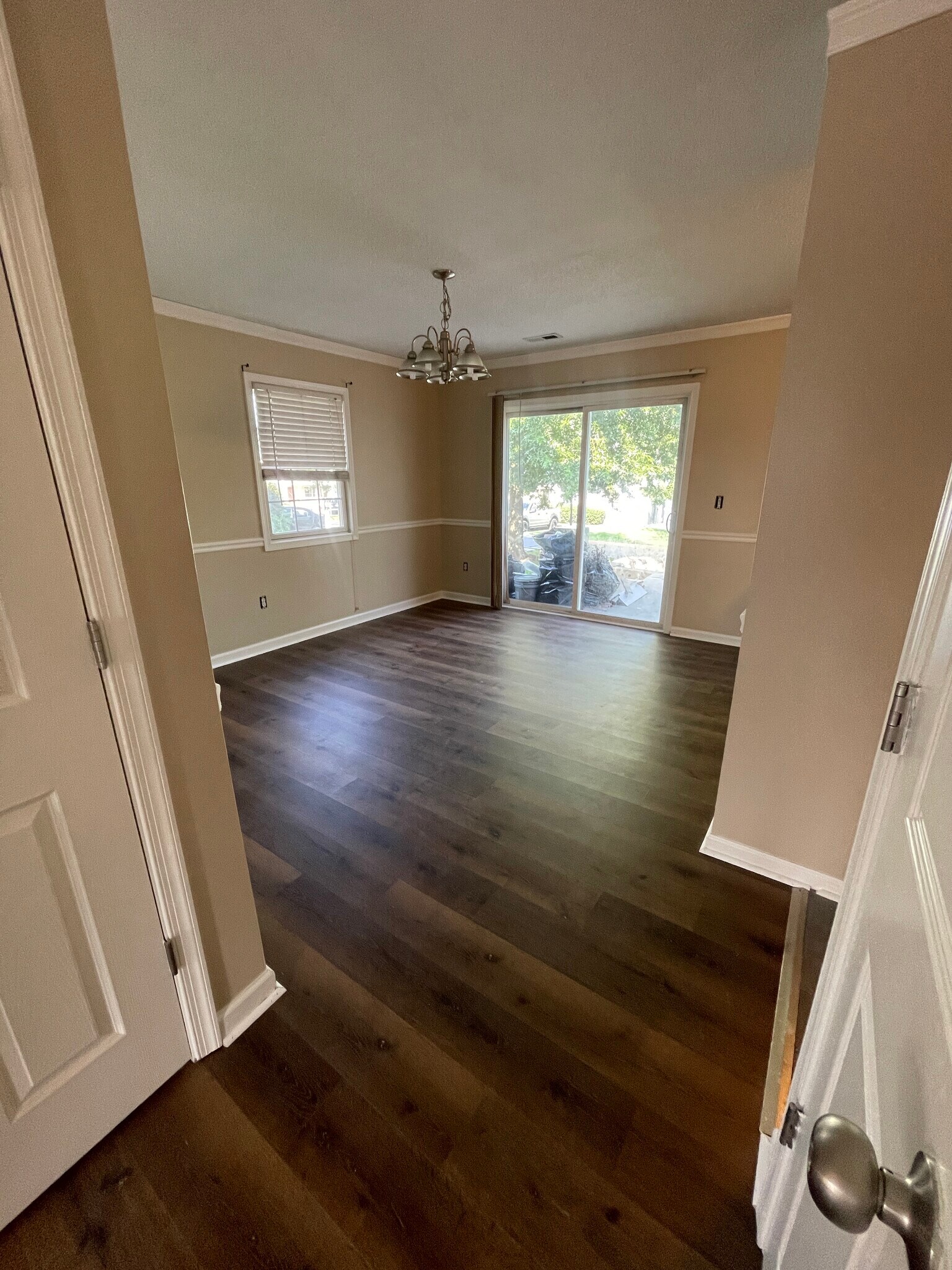 Dining room with sliding doors to back patio and storage unit - 1419 Founders Way