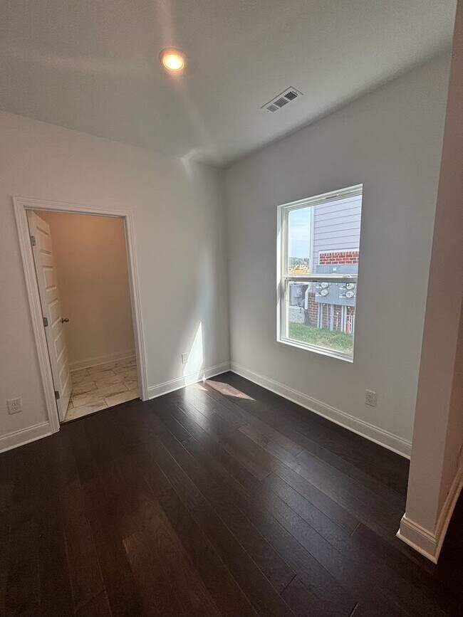 Building Photo - **BE THE LUCKY ONE TO LIVE IN THIS 2024-BUILT END-UNIT TOWNHOME IN A RESORT-STYLE COMMUNITY**