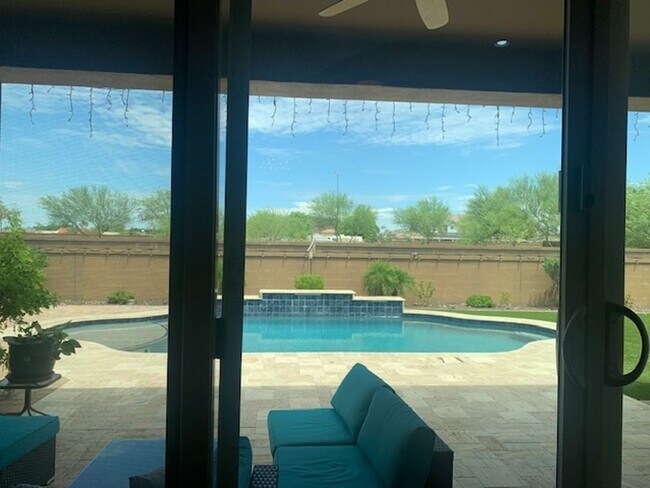 Building Photo - Gorgeous 5 Bed 3.5 Bath 3 Car garage home with private pool + SOLAR in gated community in Peoria