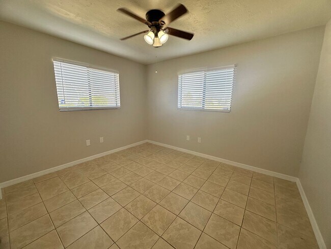 Building Photo - Fenced 3/2 with Screened Lanai in NE Cape Coral