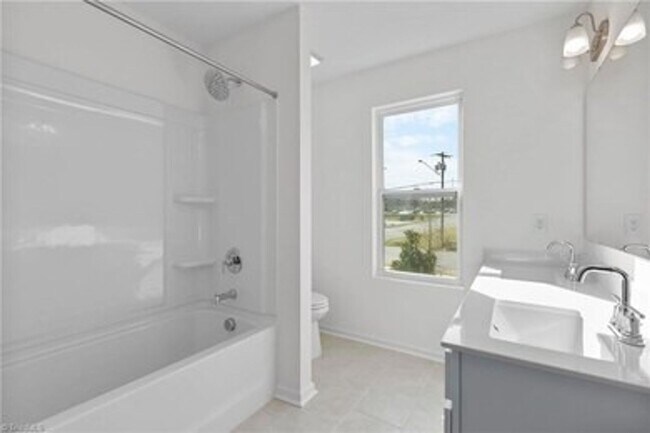 Building Photo - Spacious 3-Bedroom Townhome with Private Patio, Central HVAC & In-Unit Laundry Hookups