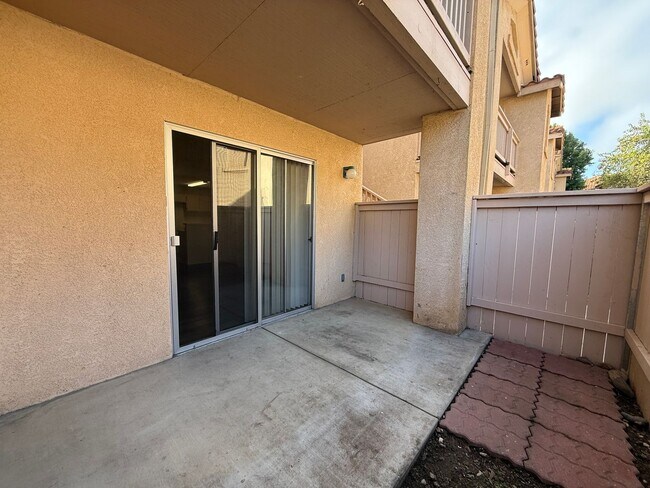 Building Photo - Downstairs Corner Condo in the Gated Commu...
