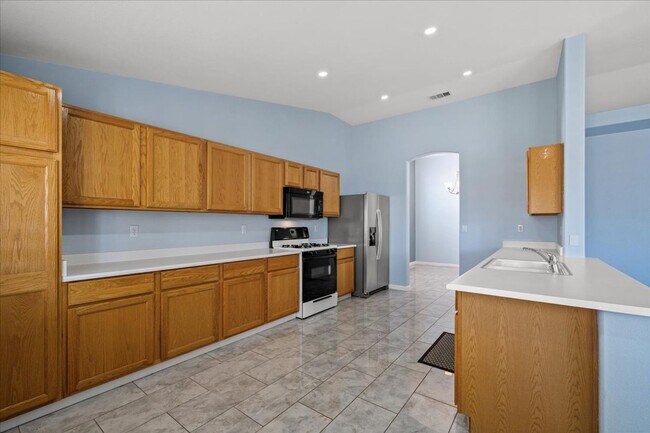 Building Photo - Multiple Living Areas 4-Bedroom Retreat with Vaulted Ceilings & No Carpet