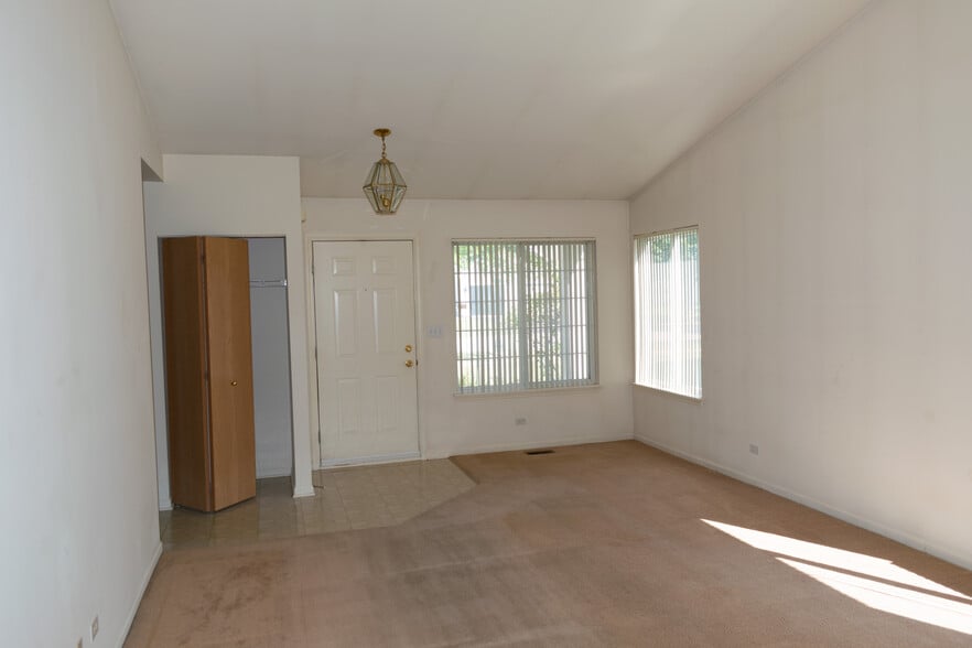 Living Room Looking to Front Door - 61 W Providence Ln