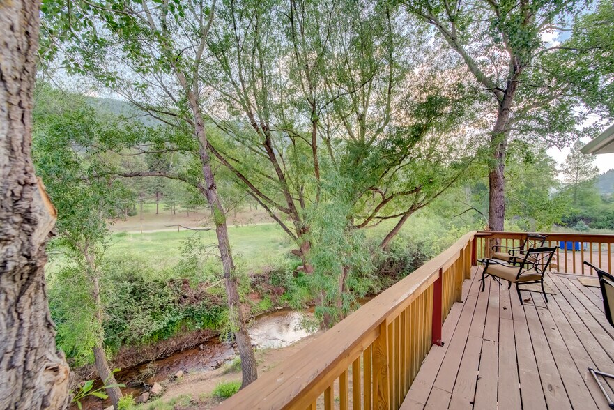 Deck of Condo 2 Overlooking Creek - 9305 Chipita Park Rd