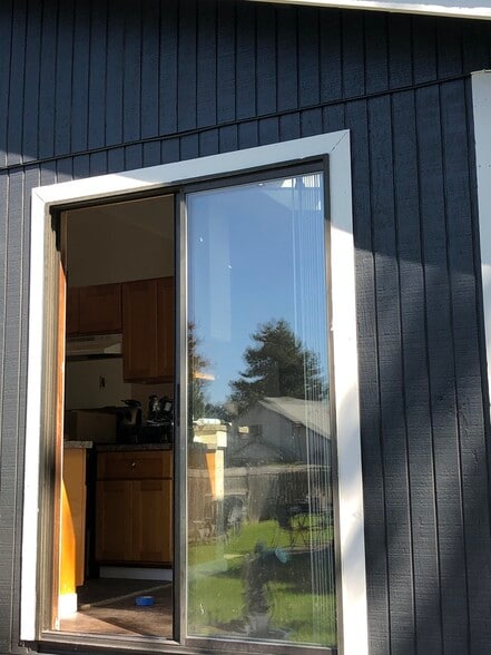 Patio from Kitchen opens to a huge yard. - 219 E 36th St