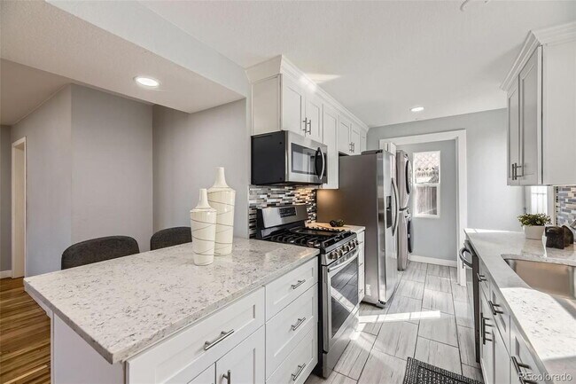 Building Photo - "Charming 3-Bed Denver Gem with Gleaming H...
