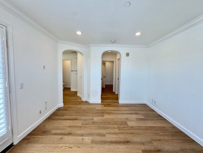 Building Photo - Beautifully Remodel Townhouse with AC & Two Car Garage!