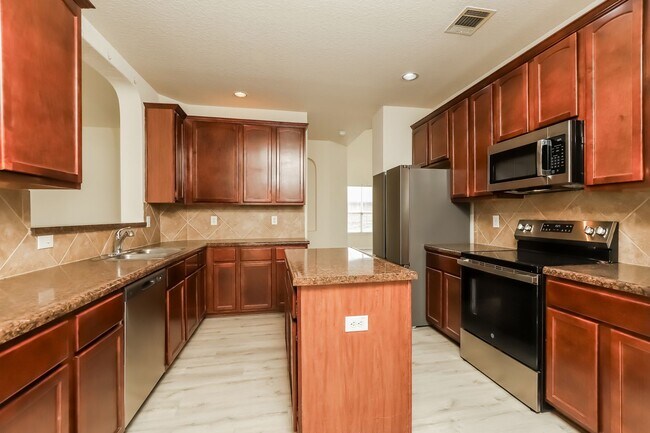 Building Photo - Spacious & Sun-Filled 4BR Retreat with Open-Concept Living and Versatile Dual Living Areas