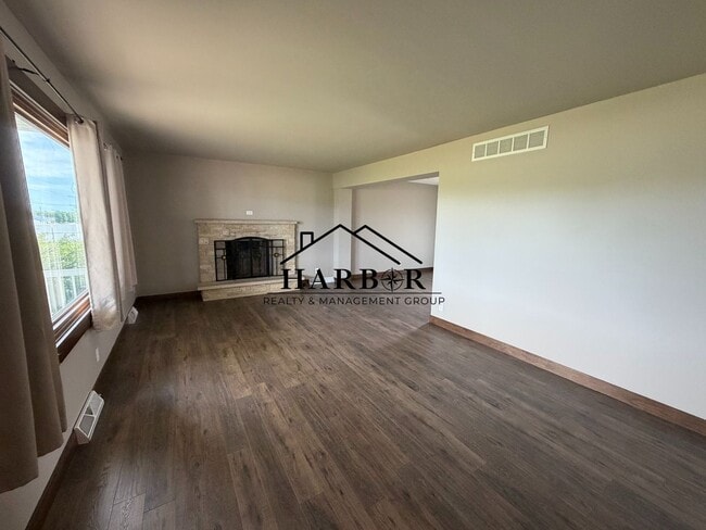 Building Photo - *1/2 Off First Months Rent* Spacious 3BR Home with 2-Stall Garage & Private Deck in Kasson