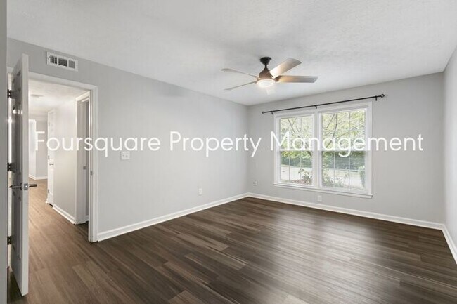 Building Photo - Charming 1st-Floor End-Unit Condo with Gas Log Fireplace, Private Back Porch & Community Pool – T...