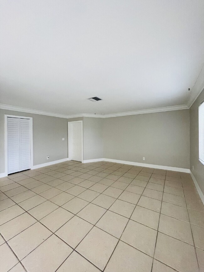 Building Photo - Updated 2-bedroom waterfront duplex with walk-in closets, enclosed Florida room, and canal views ...