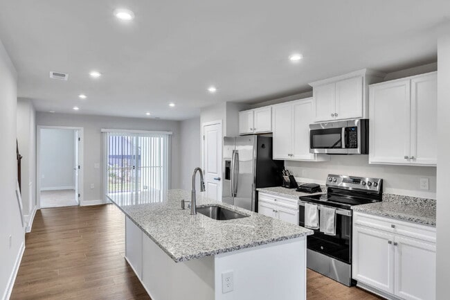 Building Photo - Modern Comfort: 3 Bed, 2.5 Bath Townhome + Primary on Main $1,995/mo rent