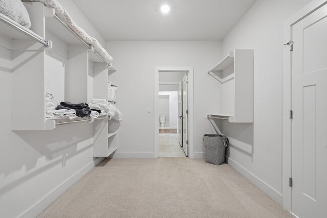 Building Photo - Stunner! This beautiful home features a spacious open floor plan with primary suite and private o...