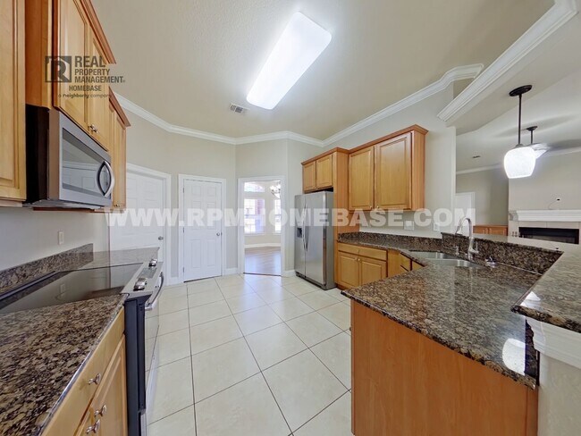 Building Photo - ELEGANT 4/3 + OFFICE IN GATED CHANAN ESTATES | Gas Fireplace + Formal Dining!