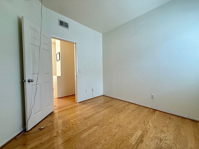 Building Photo - Spacious 3 Bedroom 2.5 Bath Townhouse with Private Garden Patio & a Community Pool/Spa! Attached ...
