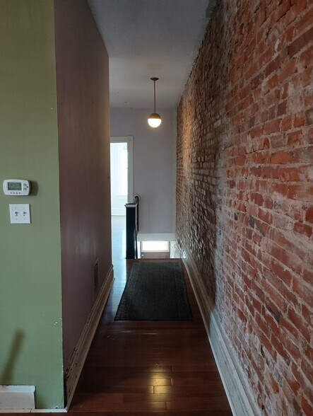 Main hallway from entrance to living/kitchen area - 4386 Chouteau Ave
