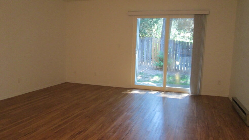 Massive living room stays cool in the summer and cozy in the winter. - 1440 Edora Rd