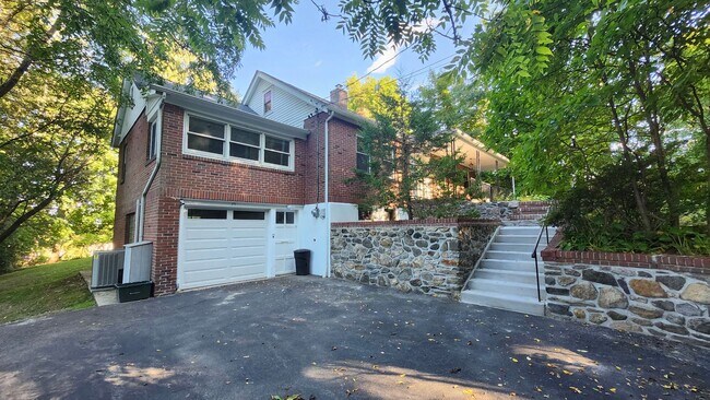 Building Photo - Elegant Multi-Level Brick Residence with Outdoor Oasis