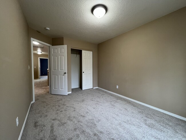 Building Photo - Inviting Two-Story 3BR Home Featuring New Carpet, New Stainless Appliances, Spacious Garage Stora...