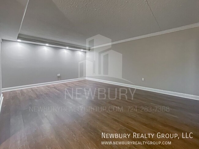 Building Photo - Luxury 1-Bedroom Penthouse with Modern Ren...