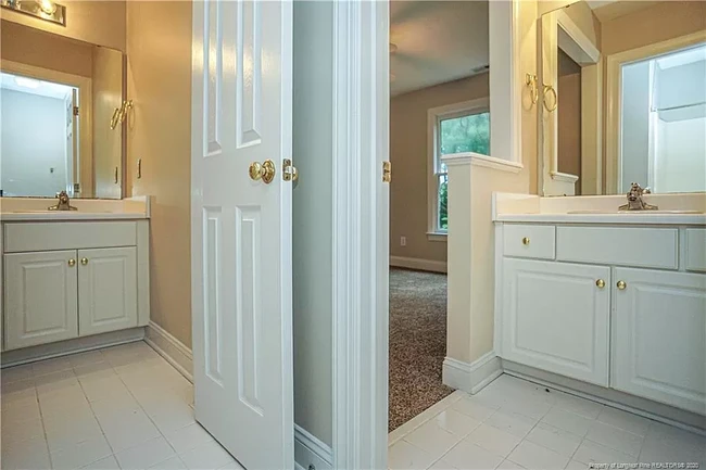 Full bath has unique access to bedroom 1 and hallway, each with separate sinks - 1977 Culpepper Ln