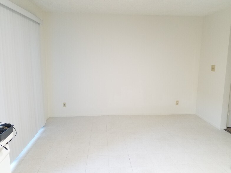 Dining room with patio door leading to garage - 120 s - 725 Windwood Dr