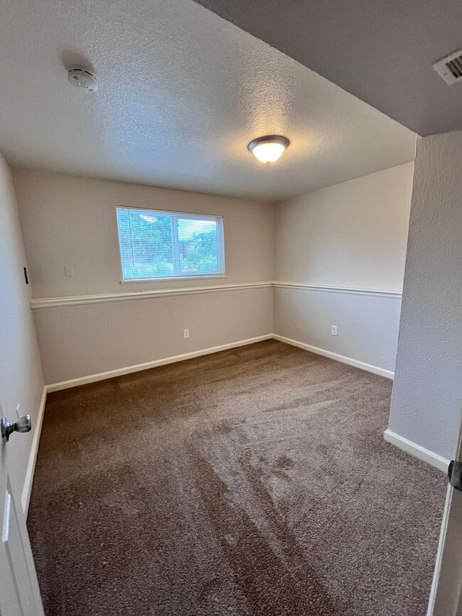 Building Photo - Welcome home to your updated 4-bedroom, 2 ...