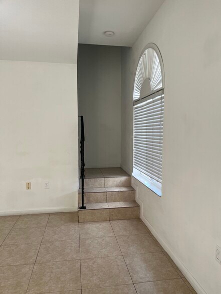 Living room to staircase - 812 NW 22nd Pl