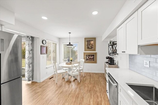 Building Photo - {10710} Updated Overland Park Townhome + Blue Valley Northwest + Two Car Garage