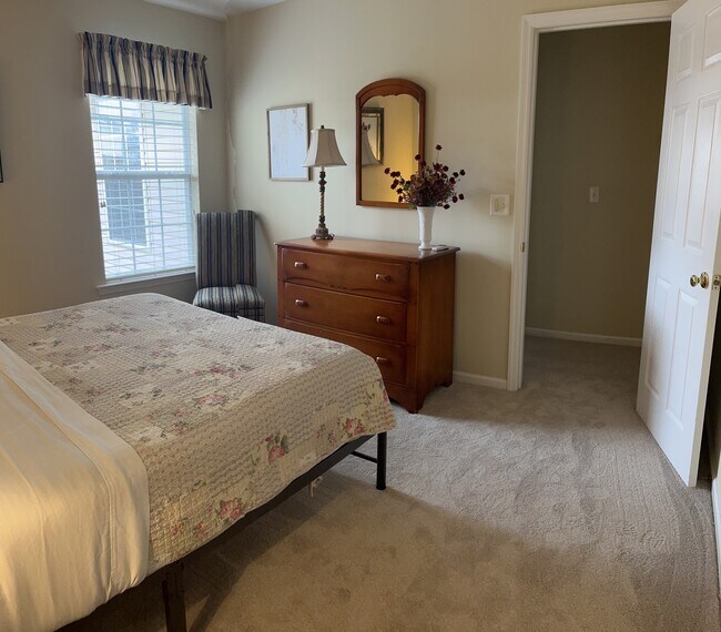 guest bedroom with queen bed - 1243 Carriage Dr