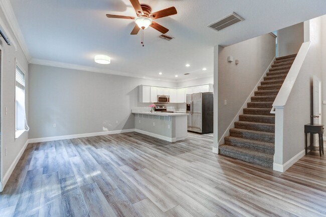 Building Photo - Gated Tampa Palms Townhome with 2-Car Garage, Screened Lanai & Community Pool