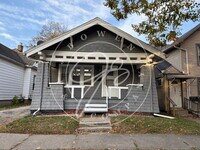 Building Photo - "Charming 2-Bedroom Home with Gleaming Har...