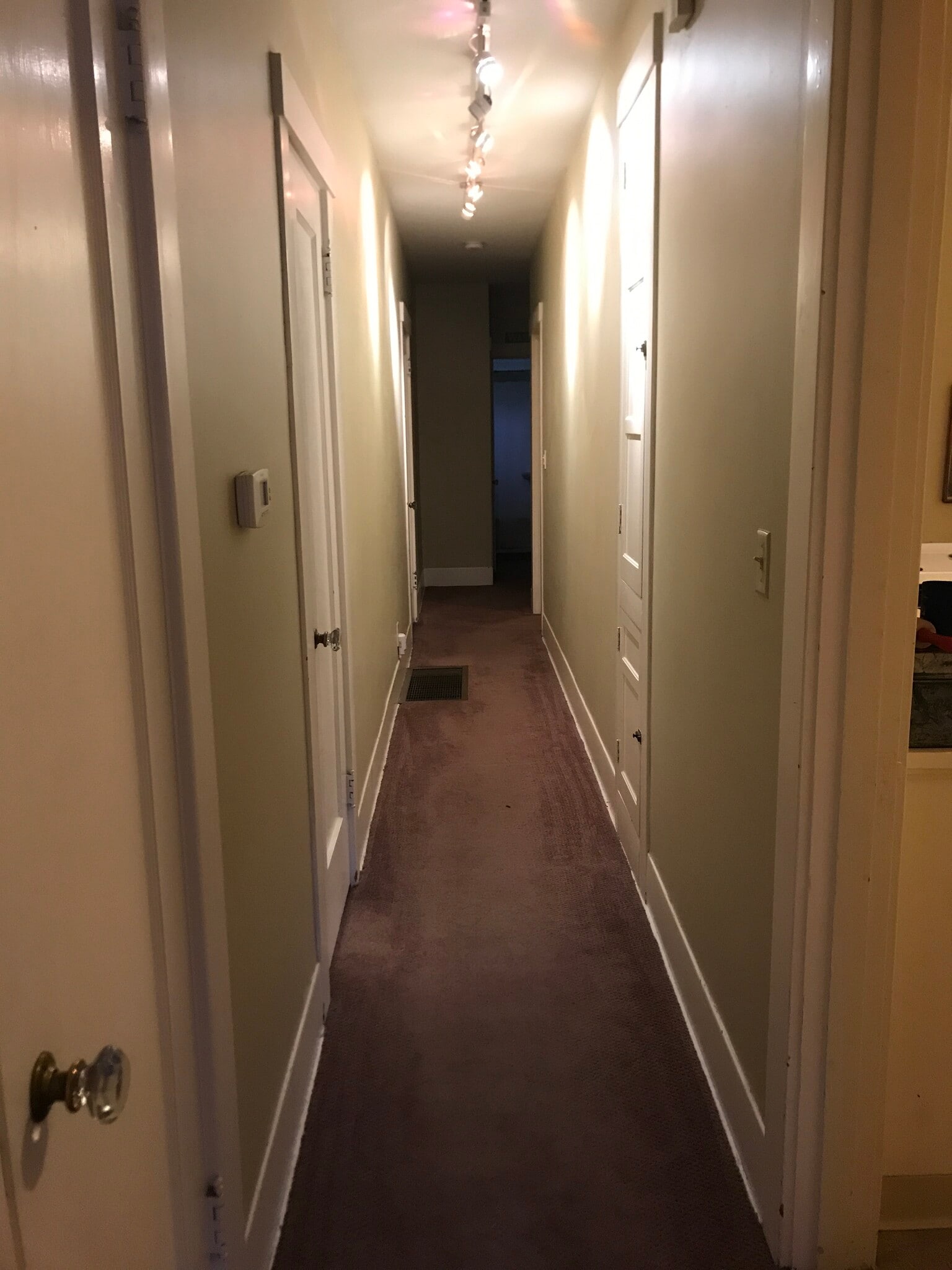 Long hallway with closets, storage and stairs to basement - 1827 NE 11th Ave
