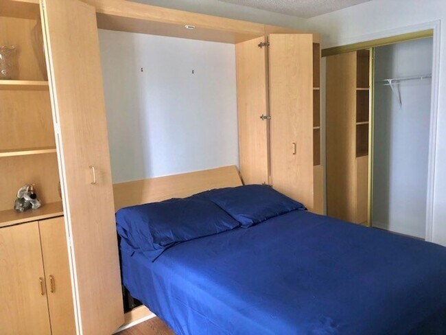 Building Photo - Nice 2X2 located on 2nd floor- Tile & lami...