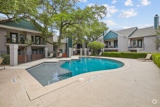 Sparkling pool with tanning deck - Apex Apartments