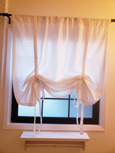 Bathroom window w/covering - 1022 N Parish Pl