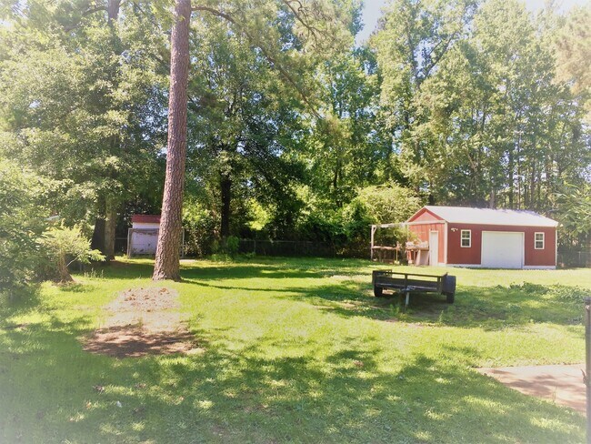 Building Photo - Cottage style brick ranch home, carport, f...